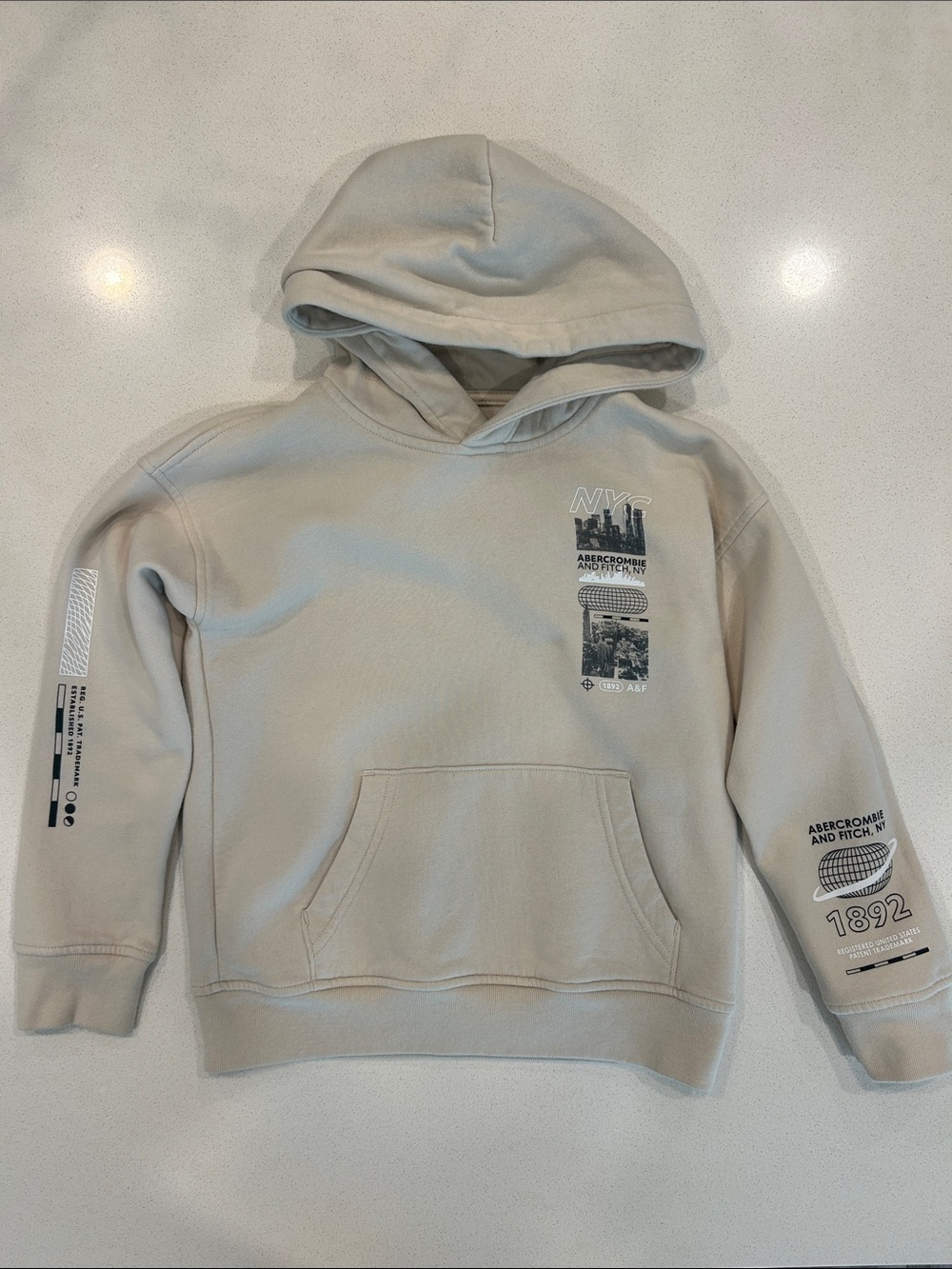 abercrombie kids beige graphic hoodie with NYC accents
